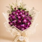 Luxury purple dendrobium orchid bouquet in ivory wrapping