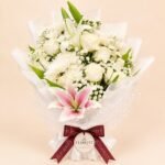 White rose and chrysanthemum bouquet with a blush pink lily