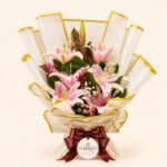 Pink lily bouquet in white and gold edged wrapping