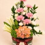 Luxury mixed flower vase with lilies roses and pink carnations