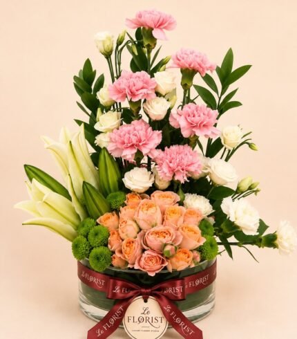 Luxury mixed flower vase with lilies roses and pink carnations