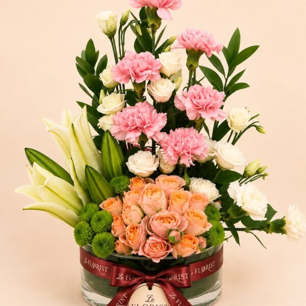Luxury mixed flower vase with lilies roses and pink carnations