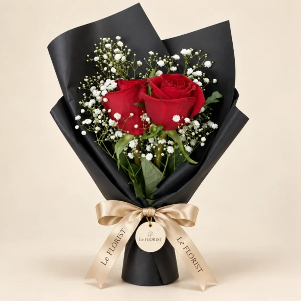 Two Red Roses Bouquet in Black Wrap by Le Florist, flower delivery in Dhaka