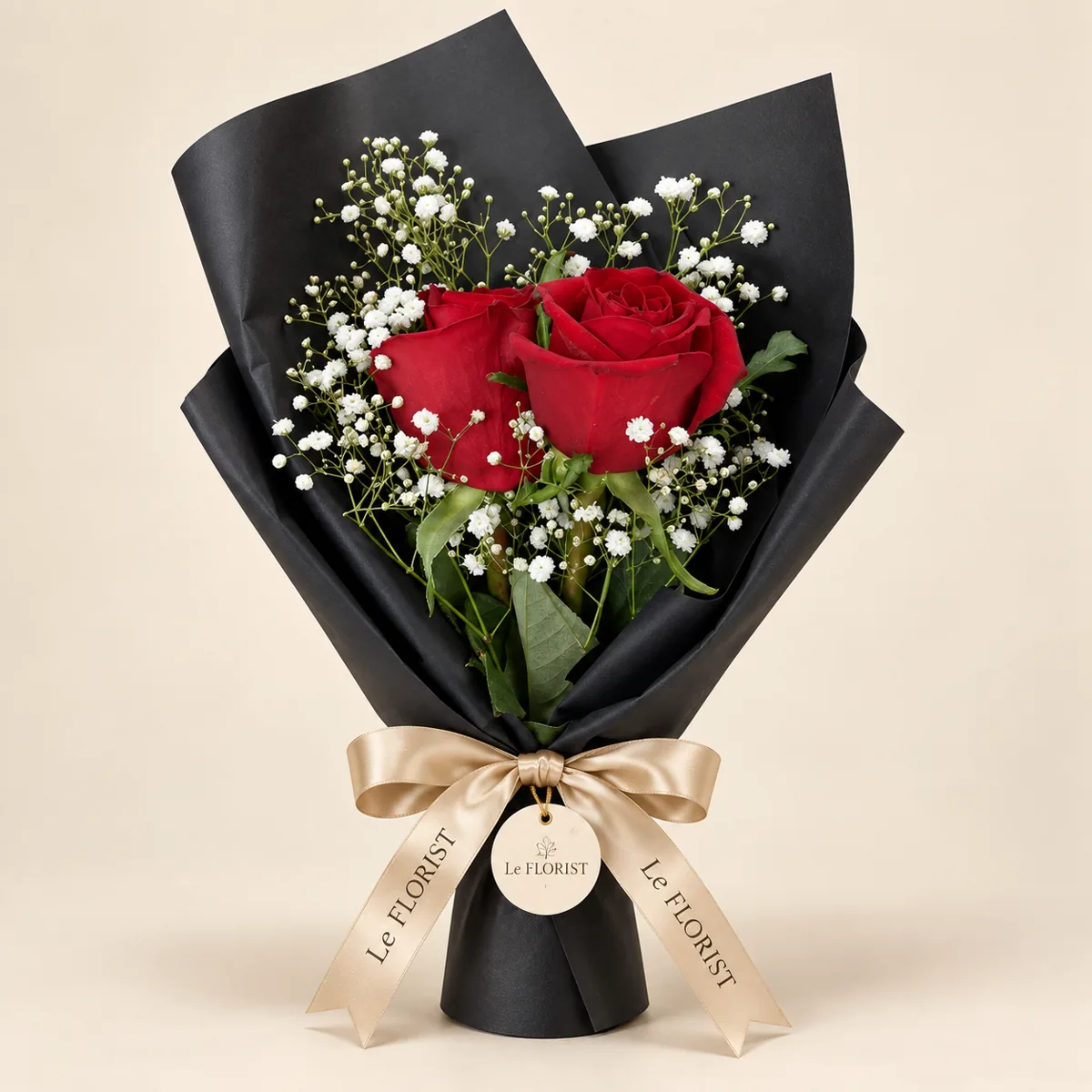 Two Red Roses Bouquet in Black Wrap by Le Florist, flower delivery in Dhaka